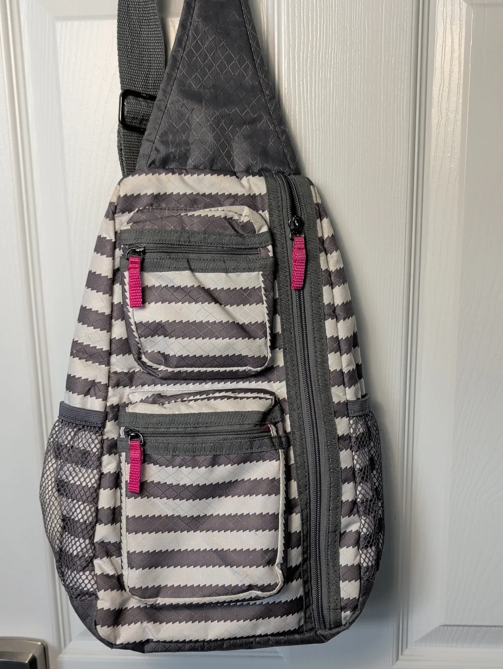 Gray Striped Sling Backpack with Pink Accents